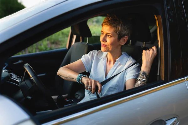 One Woman Caucasian Female Driver Sitting Car Fastening Seat Belt — 스톡 사진