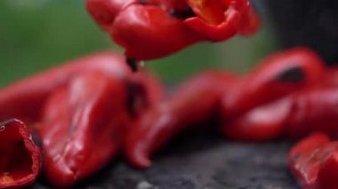 roasting paprika for winter provisions red organic peppers grill on the stove oven to be turned into ajvar a tasty spread unknown woman prepare food traditional way