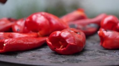 roasting paprika for winter provisions red organic peppers grill on the stove oven to be turned into ajvar a tasty spread unknown woman prepare food traditional way