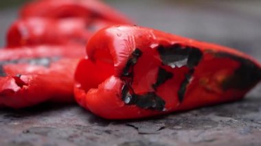 roasting paprika for winter provisions red organic peppers grill on the stove oven to be turned into ajvar a tasty spread unknown woman prepare food traditional way
