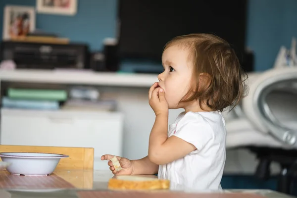 One Girl Small Caucasian Toddler Child Eat Bread Home Copy — Foto de Stock