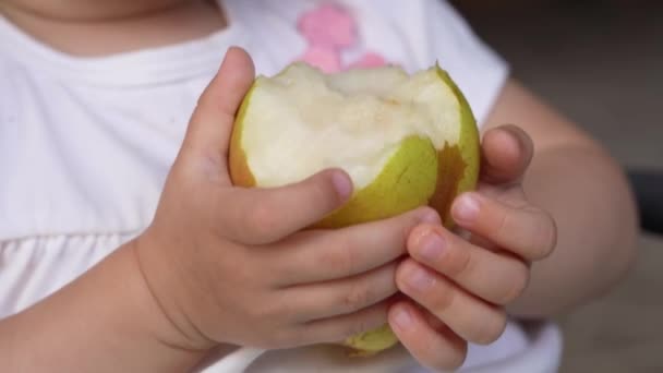 Close Hands Unknown Caucasian Child Boy Girl Hold Pear Bitten — Stock Video