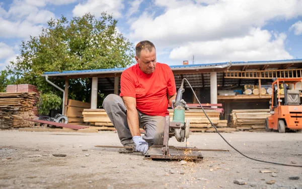 One Man Caucasian Male Construction Warehouse Worker Cutting Iron Armature — Stockfoto