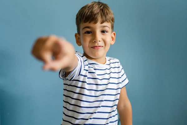 One Caucasian Boy Child Front Blue Wall Pointing Finger Camera — Stock Photo, Image
