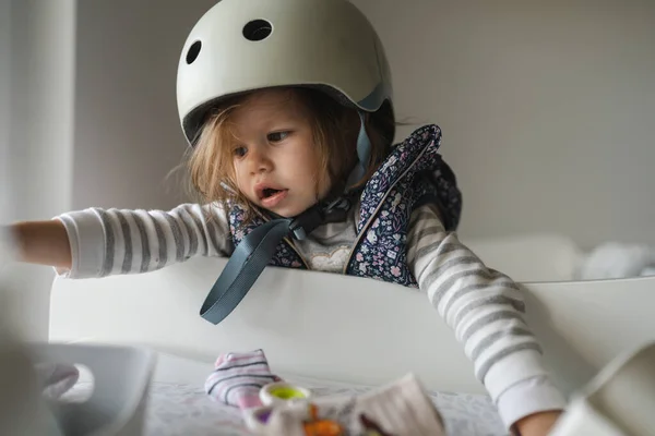 One Small Caucasian Girl Little Toddler Standing Home Playful Helmet — Stock Photo, Image
