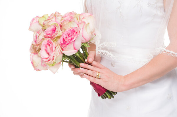 Young bride holding a bouquet on isolated white background.