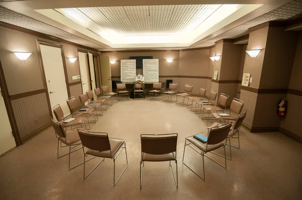 12 step recovery meeting room with chairs Stock Photo