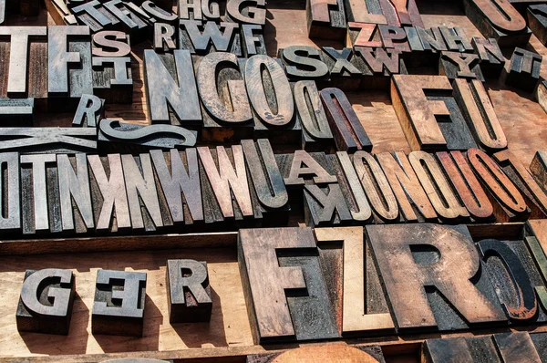A bunch of old vintage wooden block printing press letters. — Stock Photo, Image