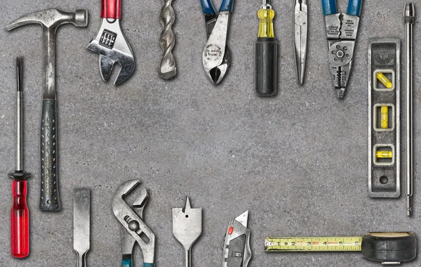 Group of used tools on concrete — Stock Photo, Image