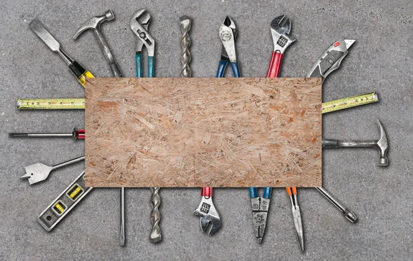 Various used tools on concrete background — Stock Photo, Image