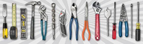 Various used tools on star burst background — Stock Photo, Image