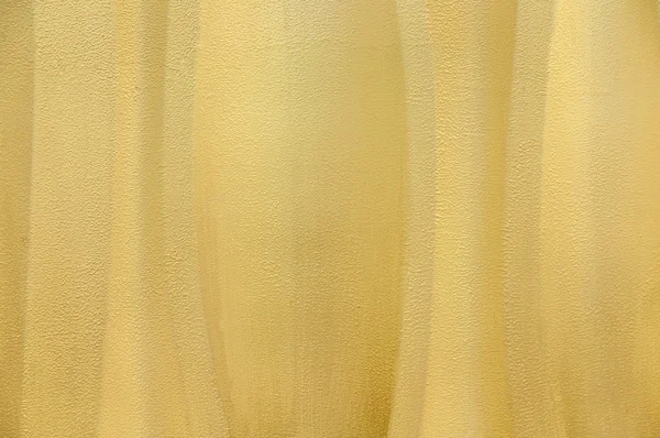 Yellow textured wavey wall background — Stock Photo, Image