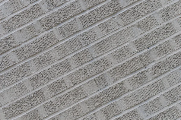Fundo de parede de tijolo angulado cinza — Fotografia de Stock