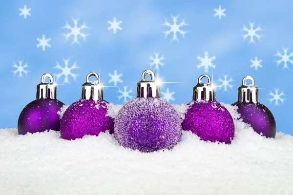 Baubles in the snow — Stock Photo, Image
