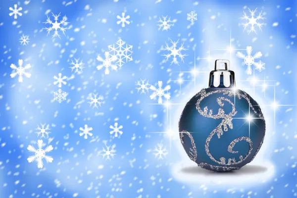 Blue Christmas bauble with a snow backround — Stock Photo, Image