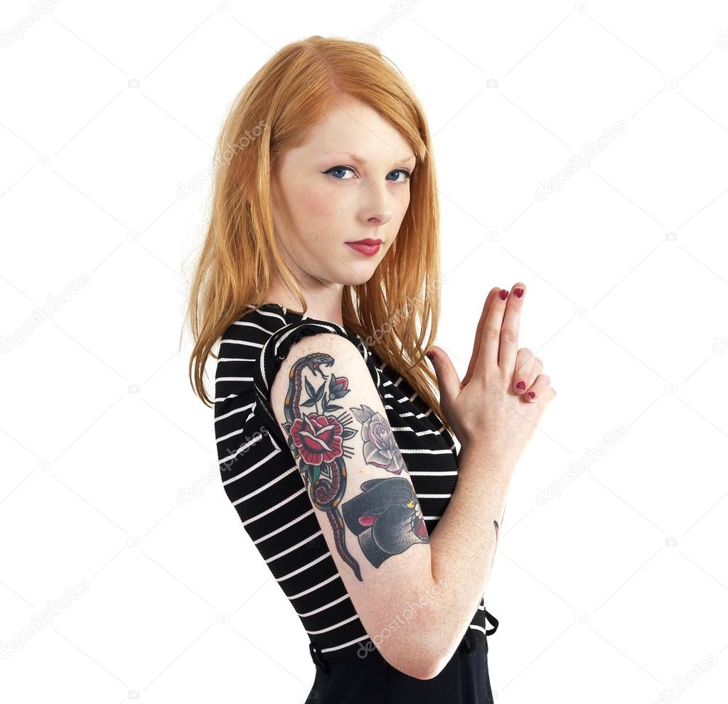 Strawberry Blonde Red Head Leaning Against Wall with Tattoo Arms
