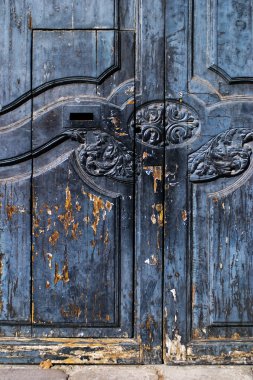 Rustic Spanish door with flaking paint clipart