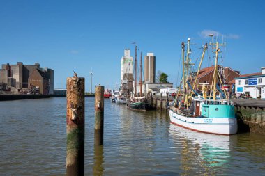 HUSUM, GERMANY - MAY 8, 2022: Harbor of Frisian city Husum on a sunny day during springtime on May 8, 2022 in North Frisia, Germany