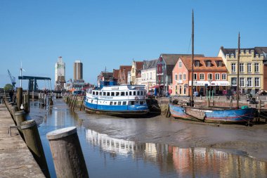HUSUM, GERMANY - MAY 8, 2022: Harbor of Frisian city Husum on a sunny day during springtime on May 8, 2022 in North Frisia, Germany