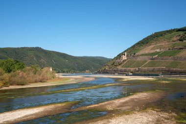 BINGEN, GERMANY - AUGUST 13, 2022: Drought in Germany, low water on Rhine river on August 13, 2022 in Bingen, Germany