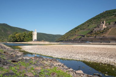 BINGEN, GERMANY - AUGUST 13, 2022: Drought in Germany, low water on Rhine river on August 13, 2022 in Bingen, Germany