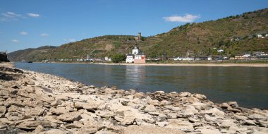 KAUB, GERMANY - AUGUST 13, 2022: Drought in Germany, low water on Rhine river on August 13, 2022 in Kaub, Germany