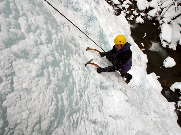 Man climbing frozen waterfall Royalty Free Stock Photos