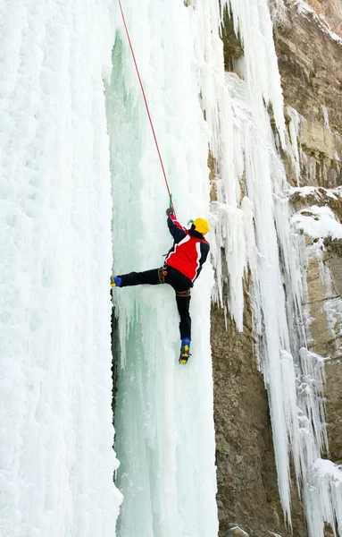 Ice climbing the waterfall. Stock Picture