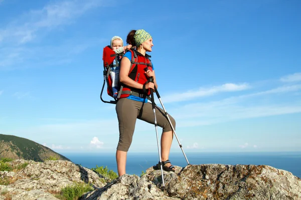 Baby carrier in alps, on sunny day — Stock Photo, Image