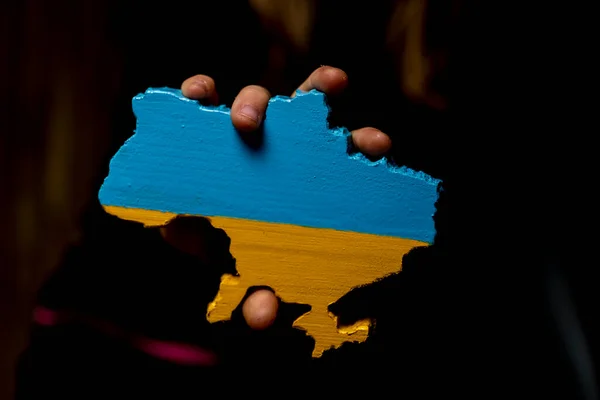 Map Ukraine Carved Wood Painted Colors Ukrainian Flag Hands Girl — стоковое фото