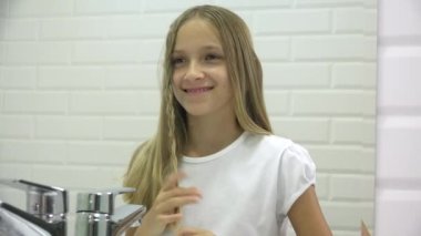 Girl Brushing Hair in Mirror, Adolescent Kid Hair Dressed in Bathroom, Teenager Blonde Child Combing, Hairstyle Beauty Industry