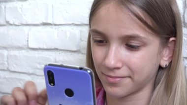Young Girl Playing Smartphone, Kid Browsing Internet on Phone, Teenager Child Reading Messages, Searching Online on Devices