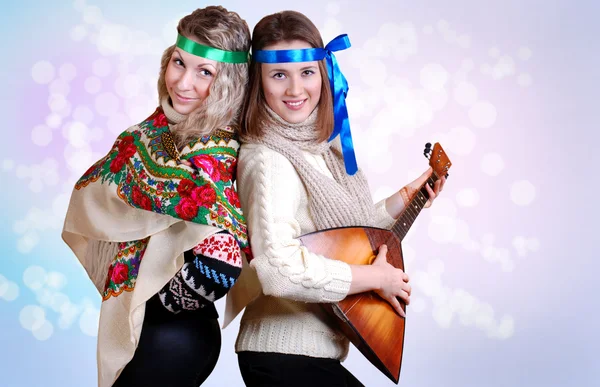 Two russian beauty girls with folk attributes — Stock Photo, Image