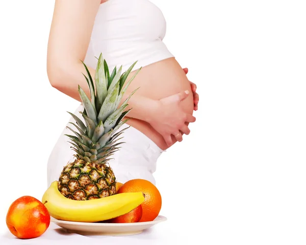 Fuits and pregnant tummy — Stock Photo, Image