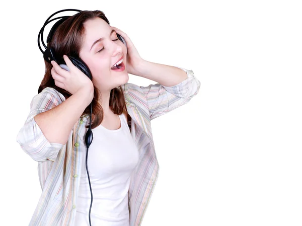 Portrait of singing teenage girl in headphones — Stock Photo, Image