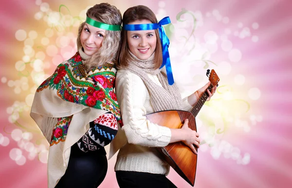 Two russian beauty girls with folk attributes — Stock Photo, Image