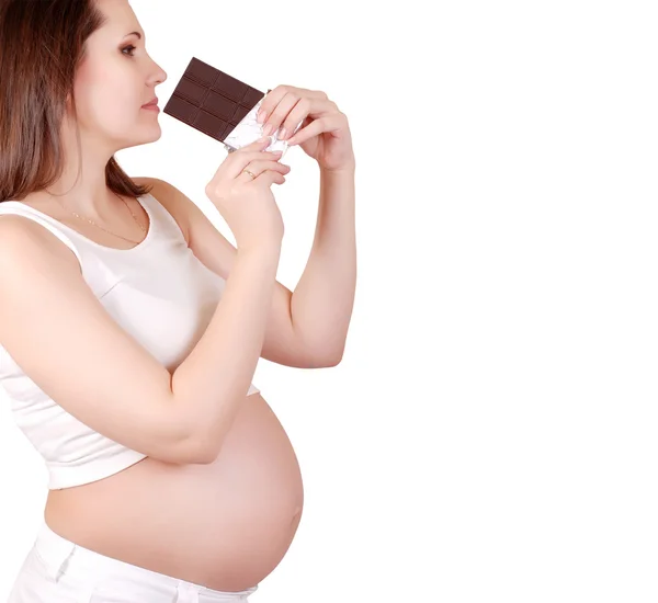 Pregnant woman with bar of chocolate — Stock Photo, Image