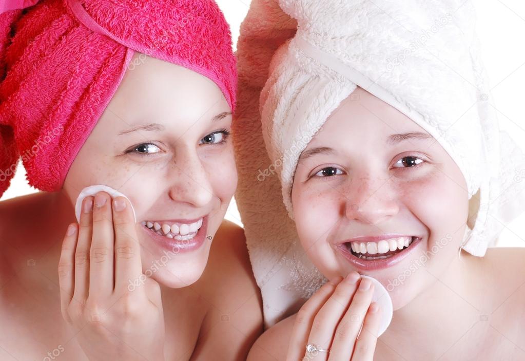 Two teenage girlfriends care for the face skin