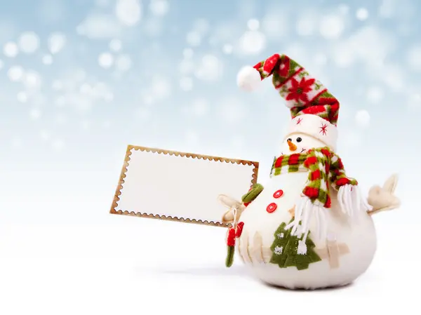 Happy snowman with greeting postcard — Stock Photo, Image