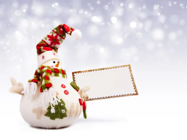 Happy snowman with greeting postcard — Stock Photo, Image