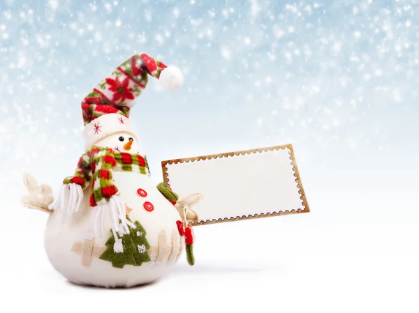 Happy snowman with greeting postcard — Stock Photo, Image