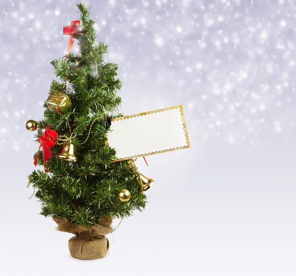 Christmas tree with greeting postcard — Stock Photo, Image