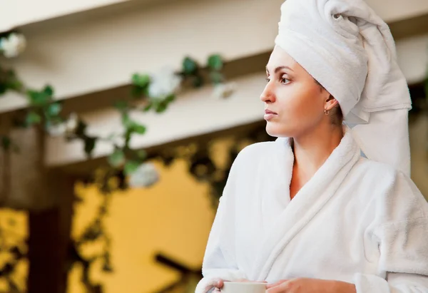 Woman in white bathrobe and towel — Stock Photo, Image