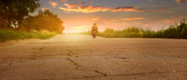 Old road closeup image at sunset time clipart