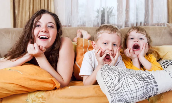 Playful children in morning bed — Stock Photo, Image