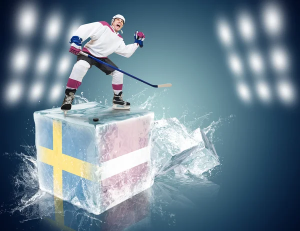 Sweden - Latvia game. Spunky hockey player on ice cube — Stock Photo, Image