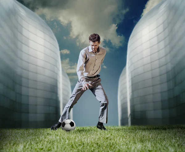 Businessman playing football — Stock Photo, Image