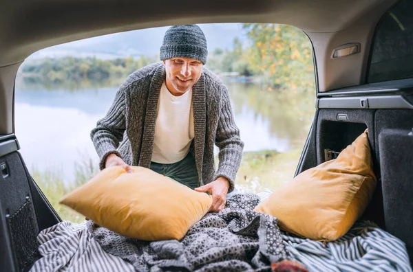 Midle Aged Smiling Man Dressed Warm Knitted Clothes Fixing Pillows — Stock Fotó