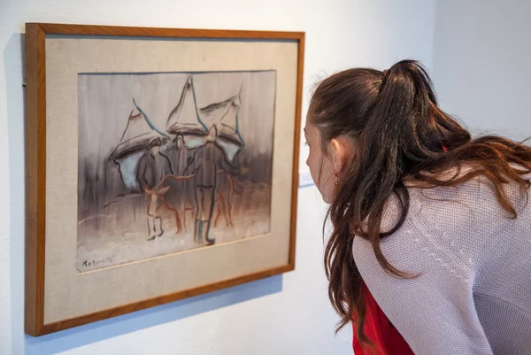 Girl looking at Bazovsky's painting, Slovakia — Stock Photo, Image