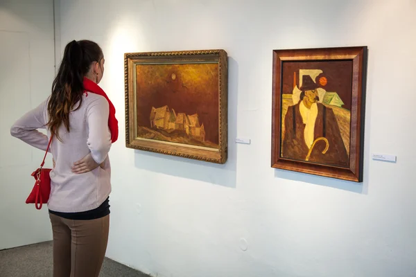 Girl looking at Bazovsky's painting, Slovakia — Stock Photo, Image